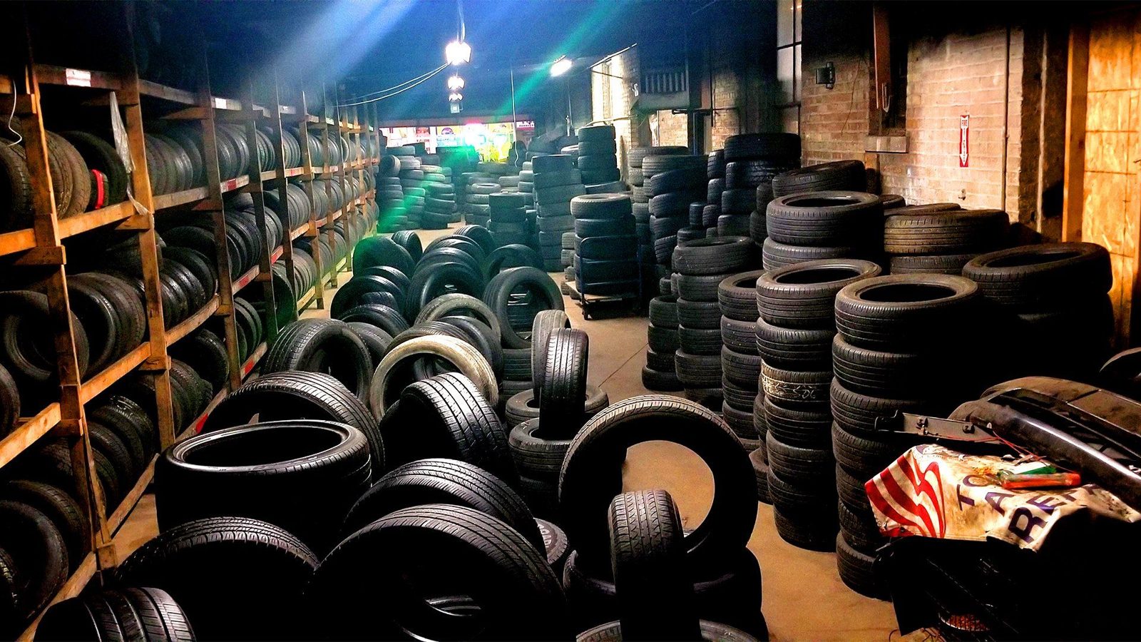 Racks and stacks of tires inside Mo Tires